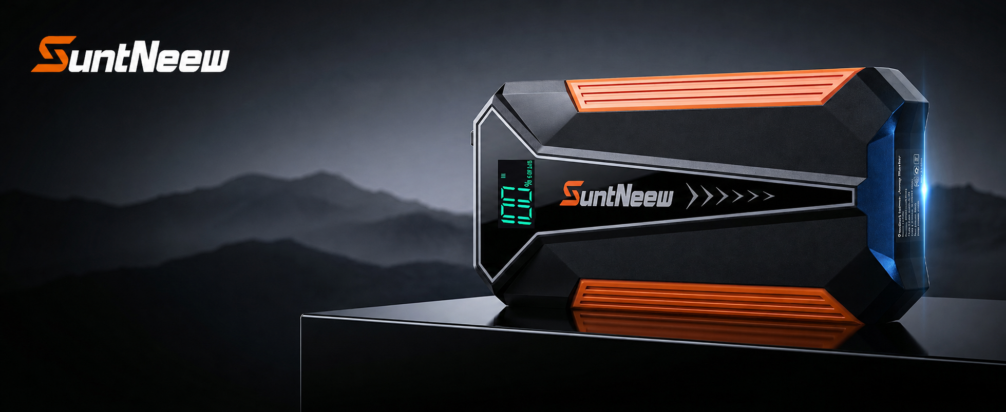 SuntNeew A20 orange jump starter on a dark platform